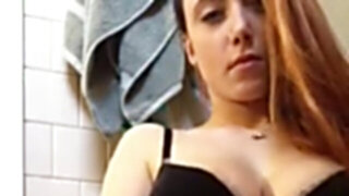 Camgirl in black bra masturbates in the bathroom
