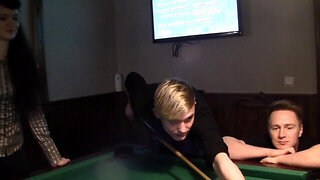 Two horny guys are sucking tits of a charming brunette