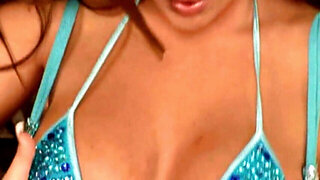 Solo pornstar in blue sticks glass dildo into wet cunt