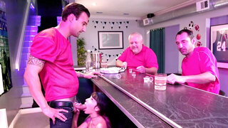 Young bitch is fucked after sucks cock under the bar counter