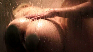 Busty blonde takes shower and girlfriend joins to have sex