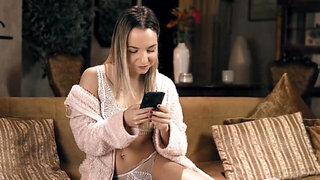 Two petite teens scissor each other's cunts on a couch