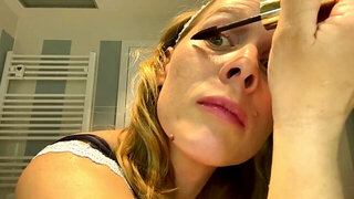 Ugly mom fondles her boobs while putting her make up on