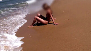 Cute babe with a hot pussy shows her goodies at the beach