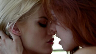 Redhead passionately makes love with blonde in living room