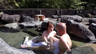 Jun Suehiro gives a handjob in a bath to a bald man